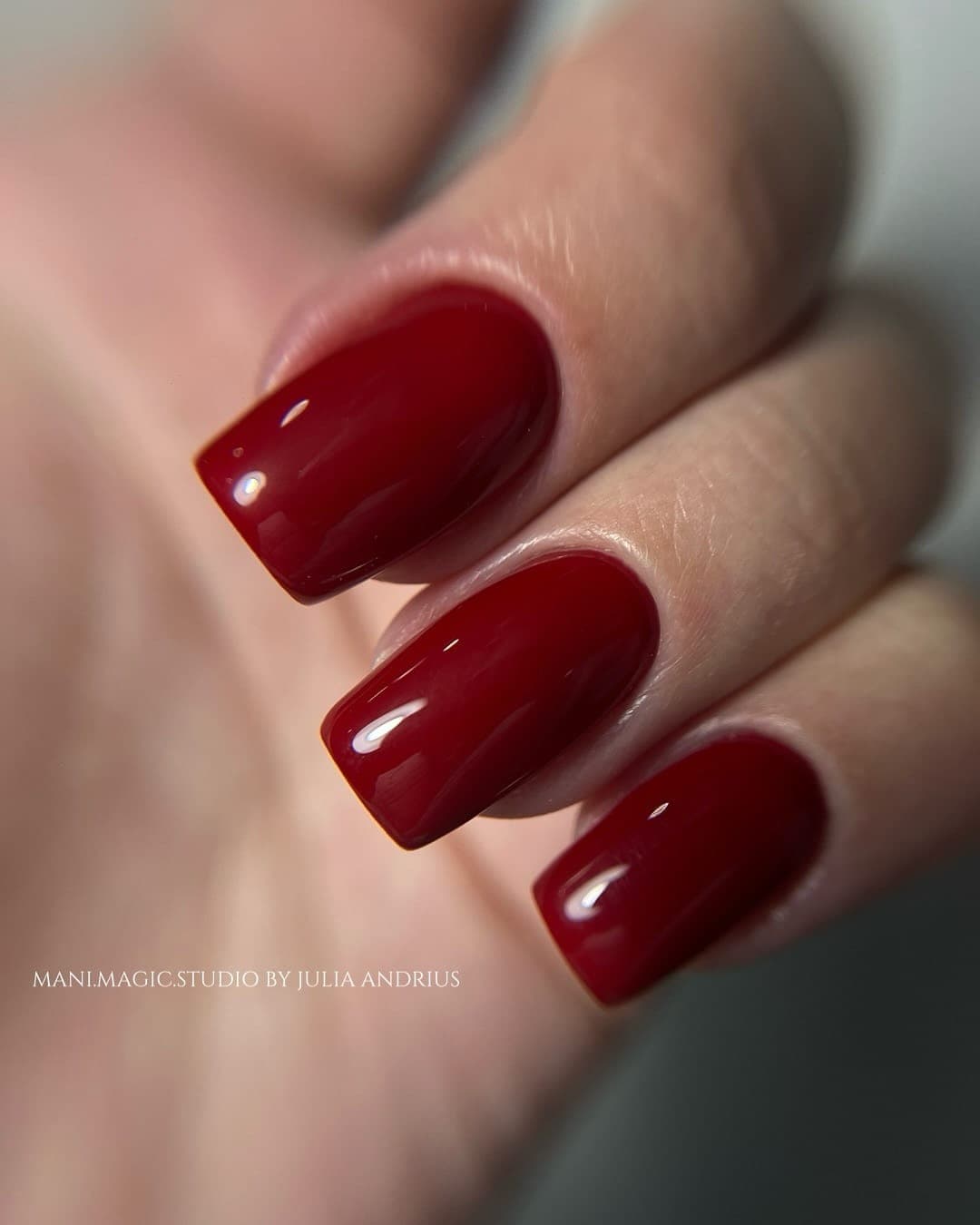 Hard gel manicure in deep glossy red with a structured apex — Mani Magic Studio, Richmond Hill